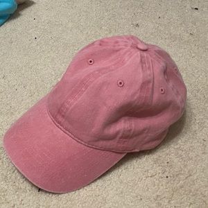Three pink workout hats.